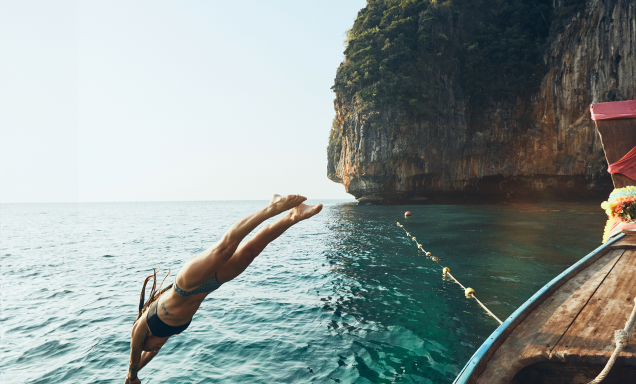 Cliff diving into a Thai bay