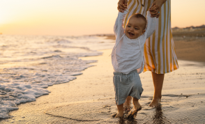 A family with a toddler on a beach
